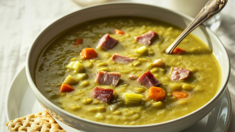 Split pea soup with ham in a white bowl