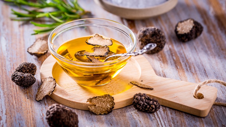 Truffle oil on a wooden board