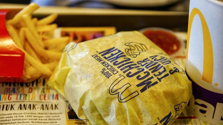 A McDonald's McChicken burger with fries on the side