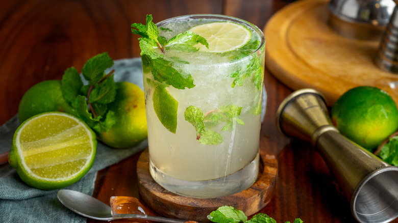 fresh mojito garnished with limes and mint