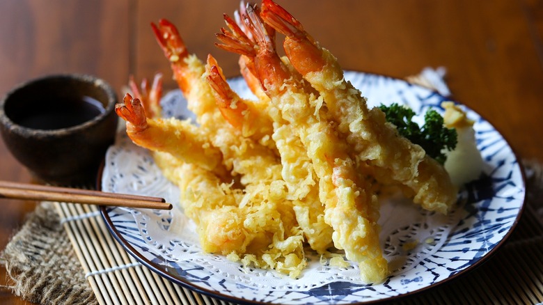 Shrimp tempura on plate with dipping sauce