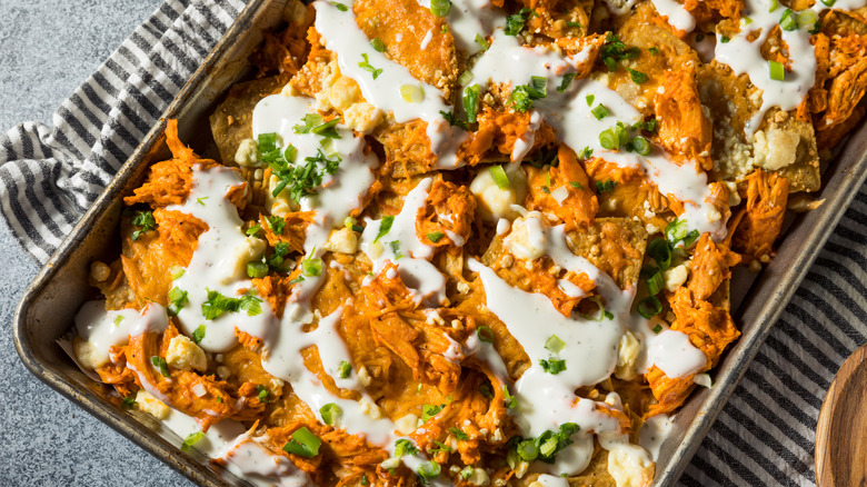 Sheet pan of buffalo chicken nachos