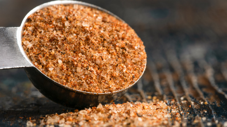 blackened seasoning spilling from a tablespoon