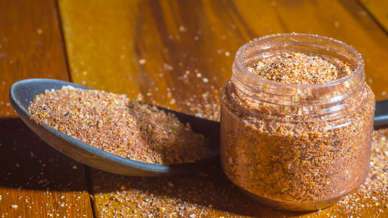 Container of dry seasoning with spoon