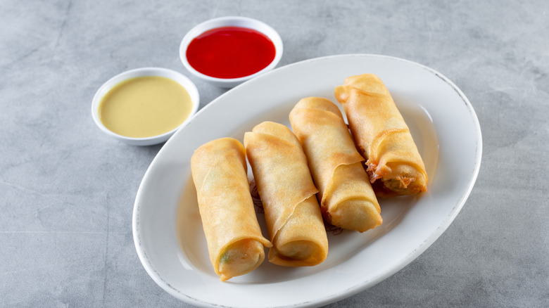 egg rolls with mustard and sweet and sour sauce
