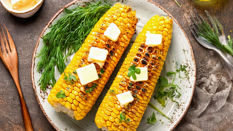 Plate of buttered corn on the cob