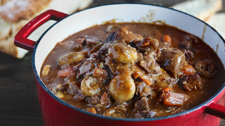 Dutch oven with pot roast in it.