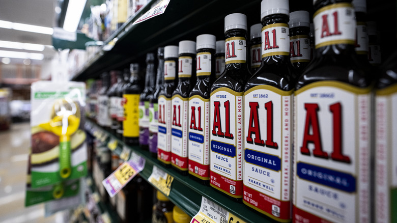 Bottles of A.1. sauce line a store shelf.