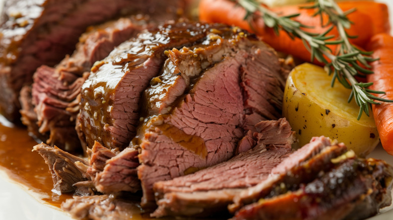 Pot roast plated with veggies.