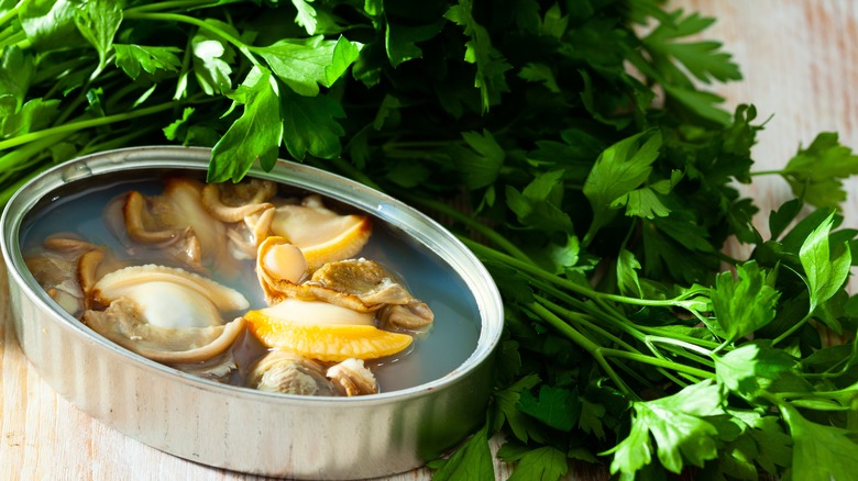 Canned clams next to parsley