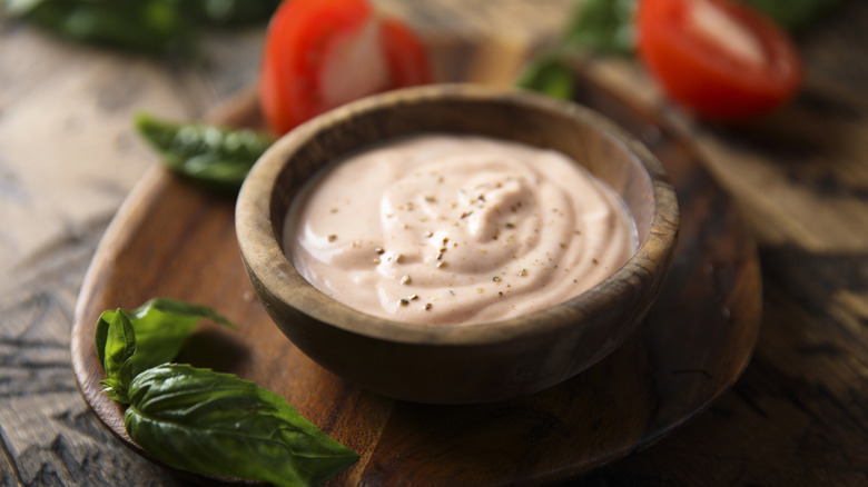 Alabama white sauce in a wooden bowl.