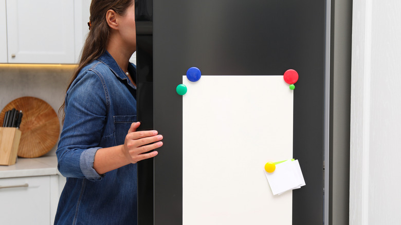 Person opening fridge