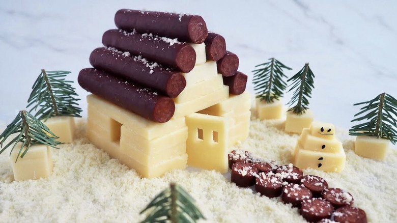 Charcuterie chalet made from cheese and meat sticks
