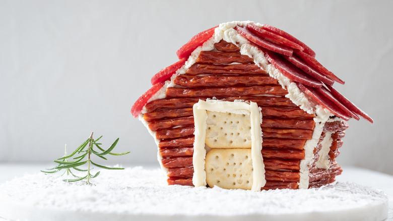 Charcuterie chalet with rosemary sprig