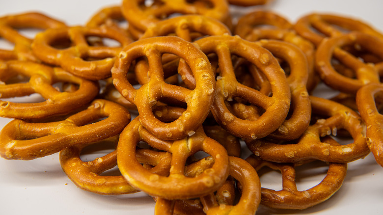 Pile of pretzels on white surface