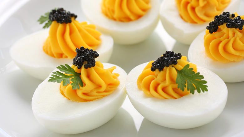 Deviled eggs with fresh herb and caviar