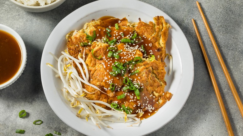 Egg foo young with sesame seeds, beansprouts, and green onions