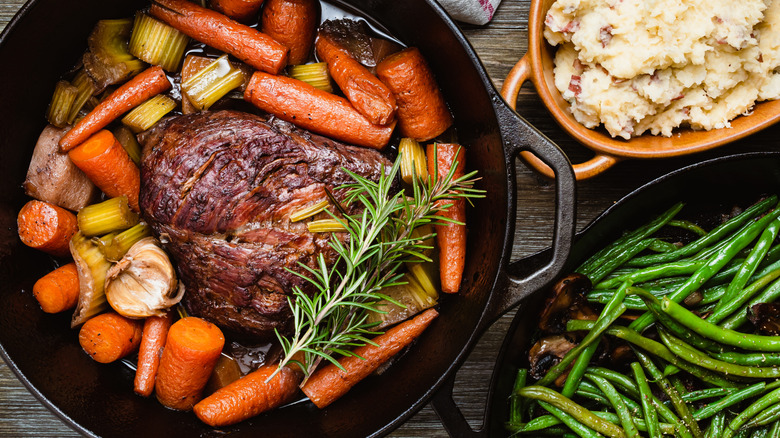 Beef is seen in a pot roast preparation.