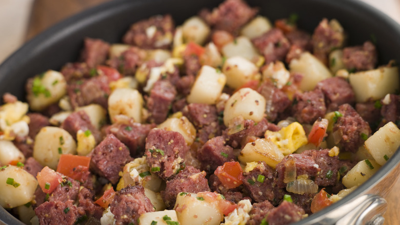 corned beef hash frying in a pan