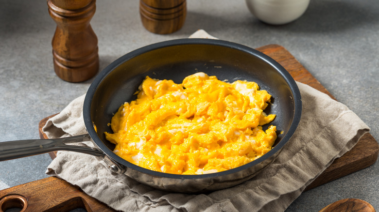 homemade scrambled eggs in a cast iron pan