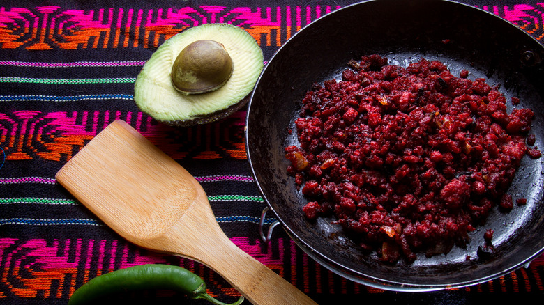browned mexican chorizo in a cast iron pan