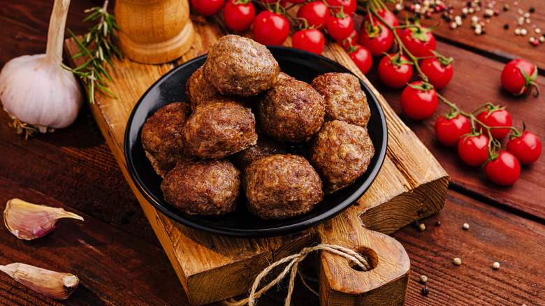 golden brown meatballs on a cast iron dish