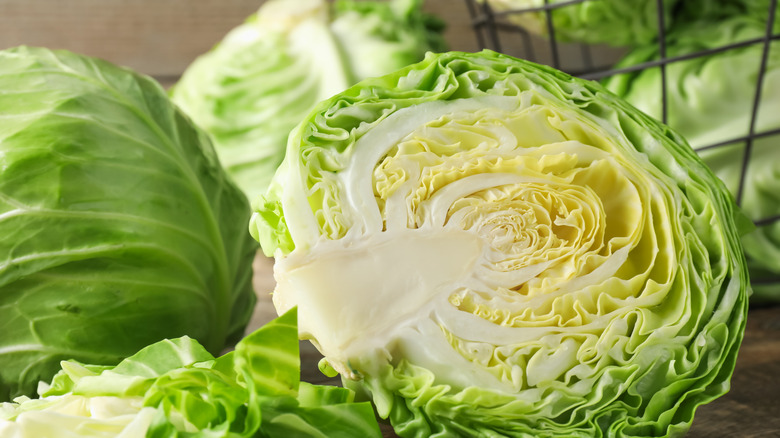 Fresh cut and whole cabbages