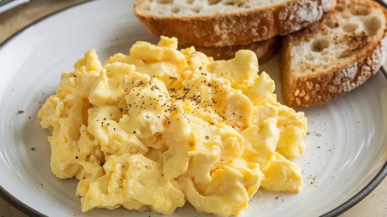 plate of scrambled eggs with toast