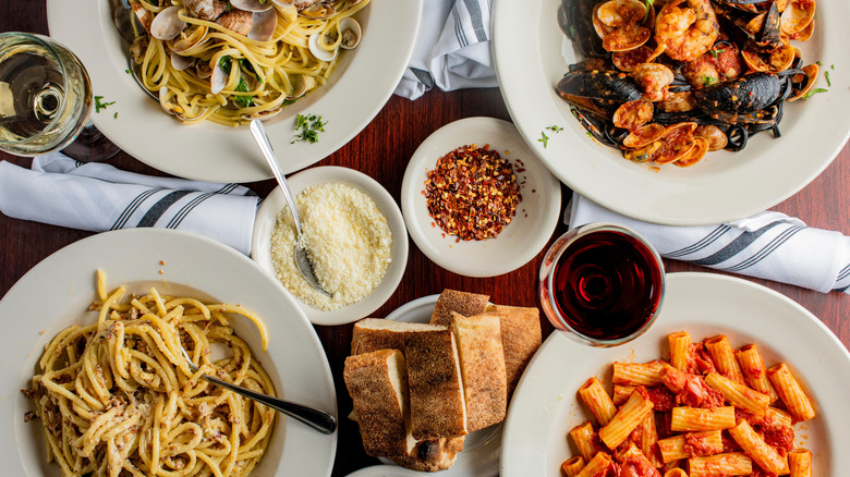 a variety of pasta dishes in pasta bowls