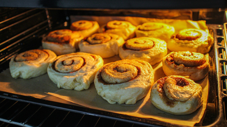 Cinnamon rolls baking in the oven.