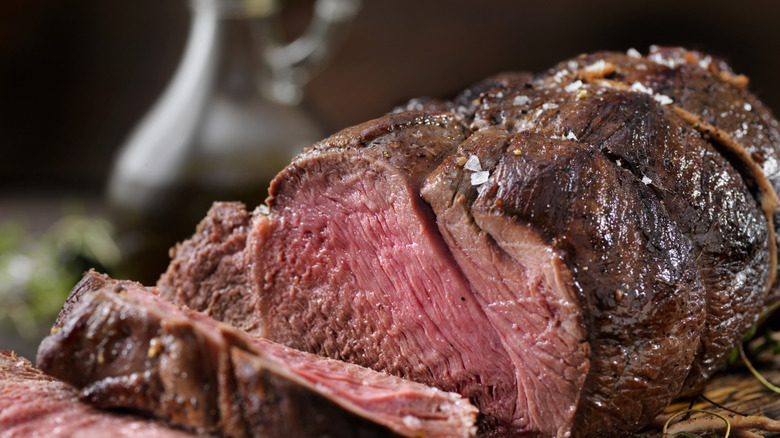 prime rib roast on a wooden cutting board