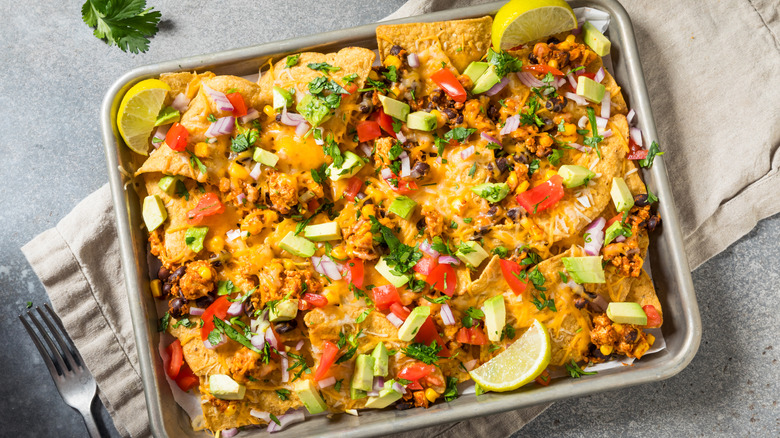 homemade nachos on a sheet pan
