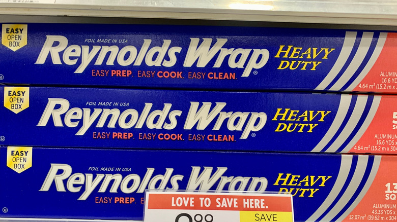 Boxes of aluminum foil are stacked at a supermarket.