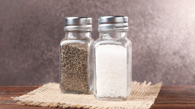 Salt and pepper shakers side by side.