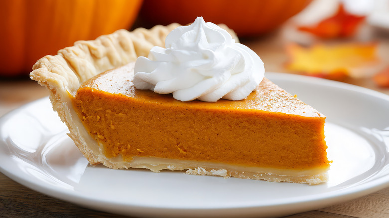 Traditional pumpkin pie on a plate
