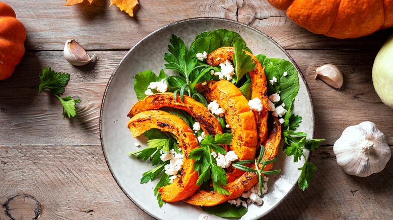 Autumn squash salad garnished with goat cheese.
