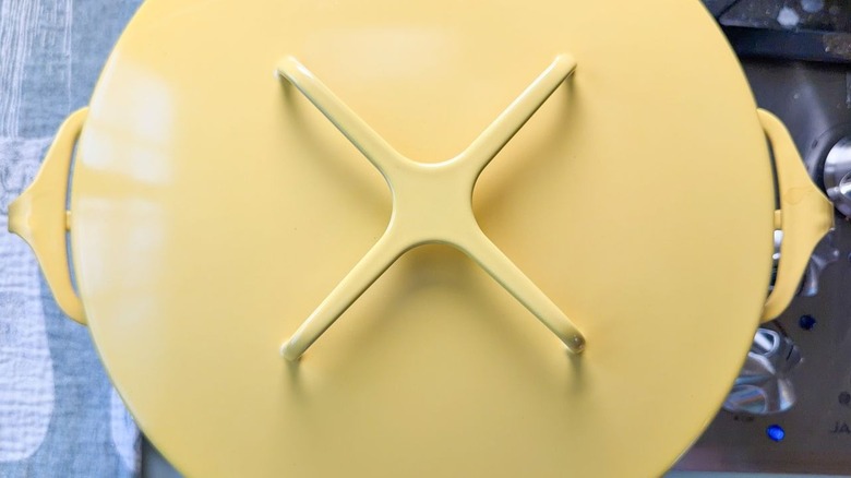 Covered yellow pot on stovetop