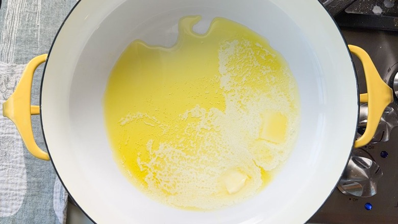 Butter and oil heating in large pot on stovetop