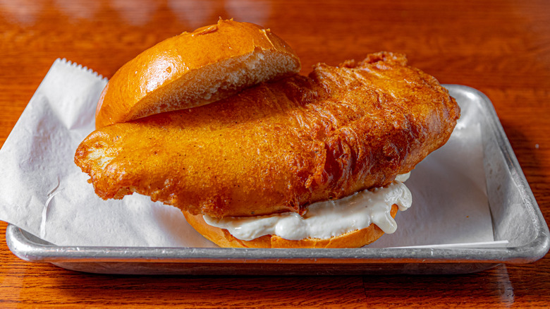 fried fish sandwich on a bun with tartare sauce