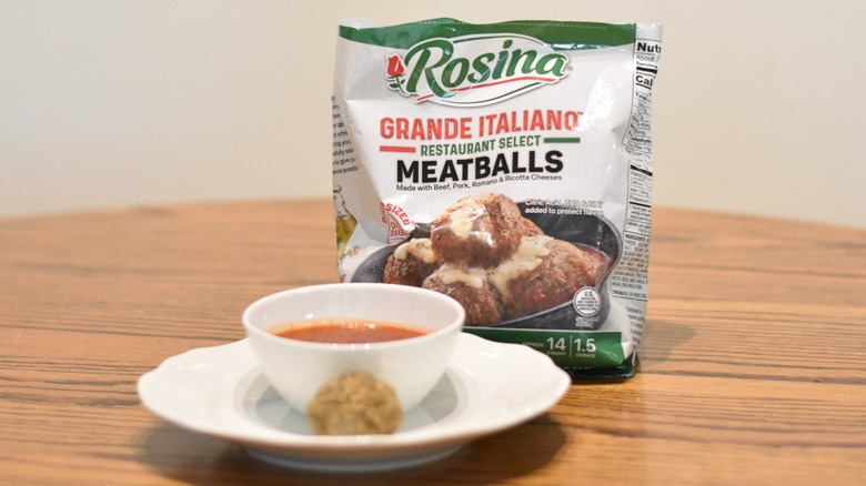 A bag of Rosina meatballs next to a meatball and marinara on a white plate