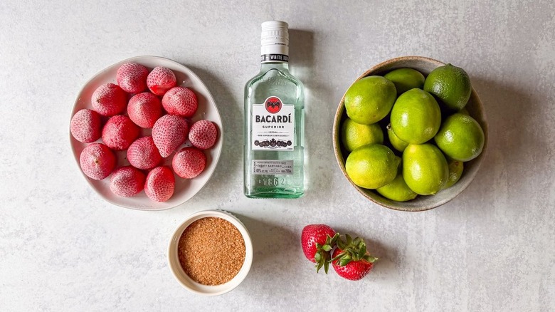 Frozen strawberry daiquiri ingredients on countertop