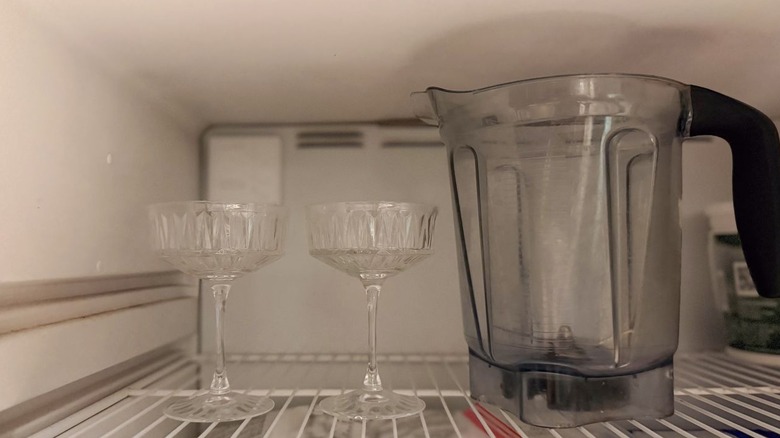 2 coupe glasses and blender pitcher in freezer