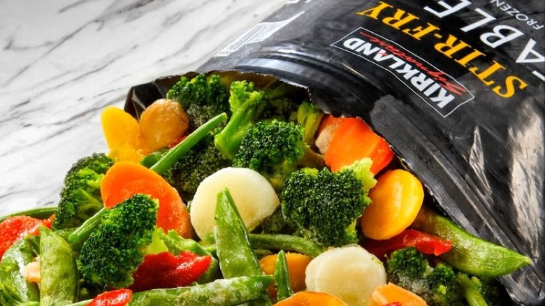 Bag of Kirkland Signature Stir-Fry Vegetable Blend spilling out onto a countertop