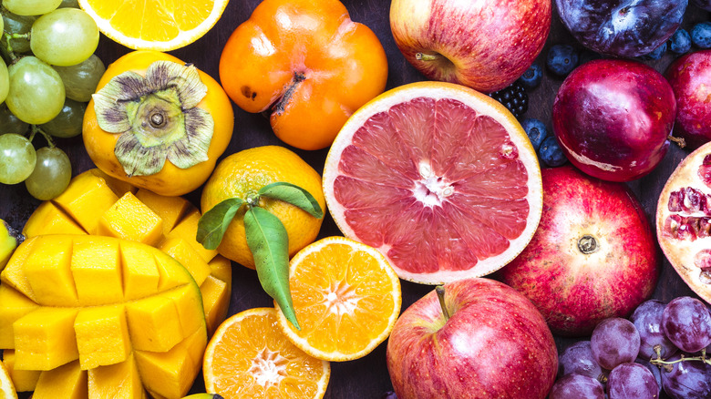 Assorted fruit cut open and whole