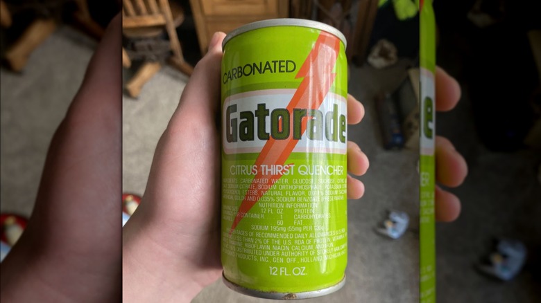 A hand holding a carbonated Gatorade can from the 1970s