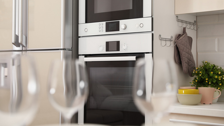 Combo microwave-oven in kitchen with glasses