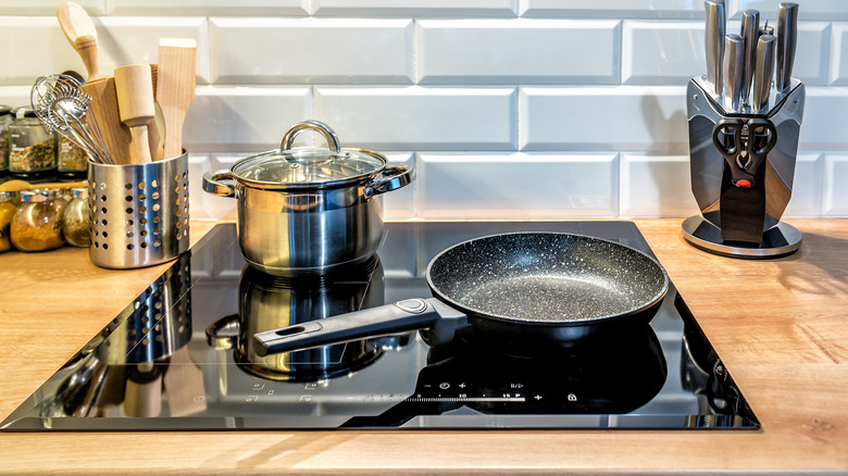 Induction cooktop with pot and pan