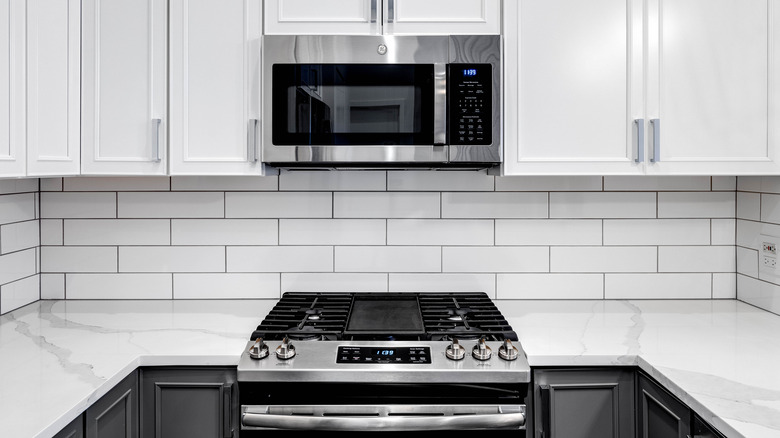 Over-the-counter microwave in white kitchen