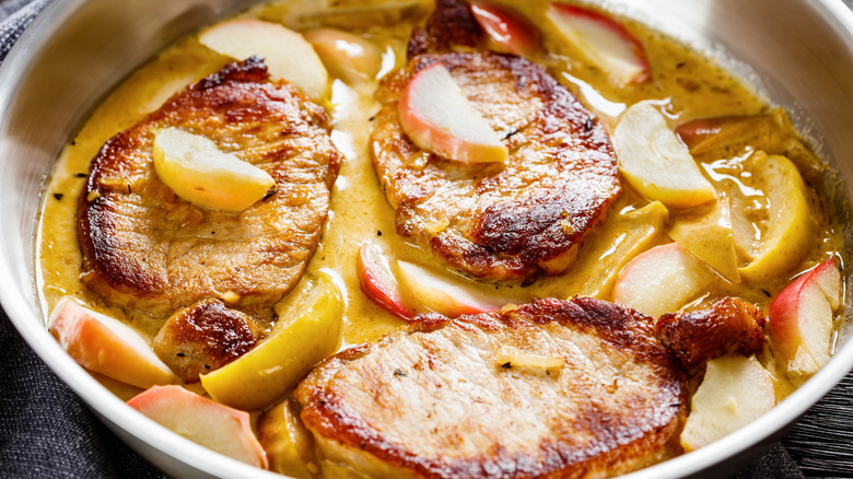 Pork and apples in a pan
