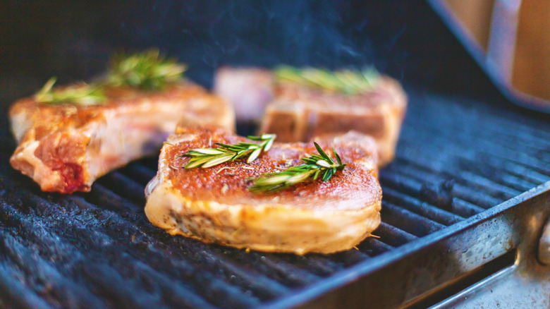 Pork with herbs on a grill
